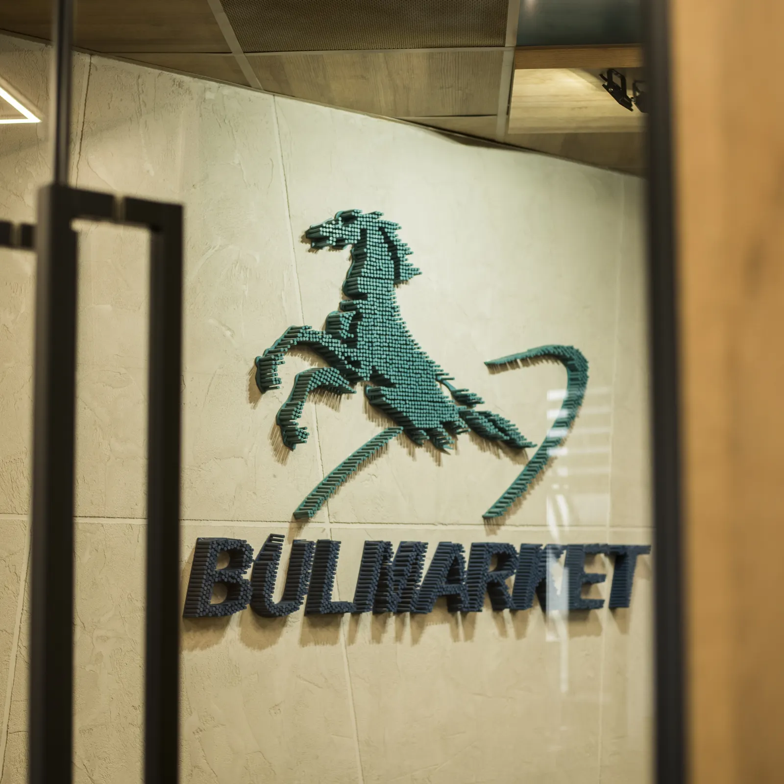 The Bulmarket mark — the horse — in relief on the wall of the head office.